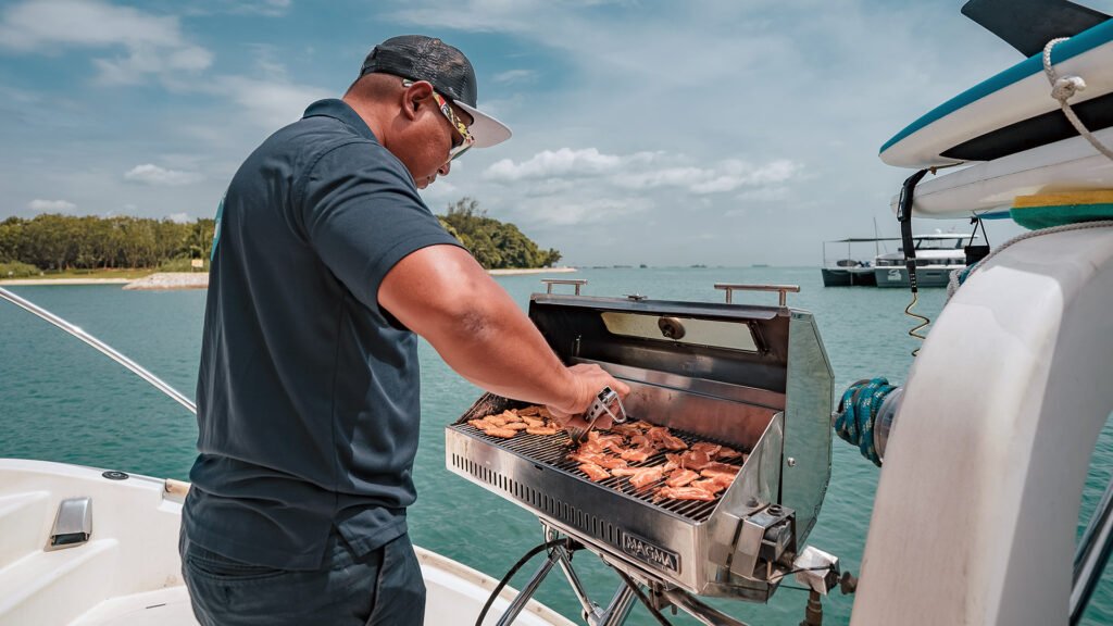 Boat crew doing BBQ on Mikanna yacht